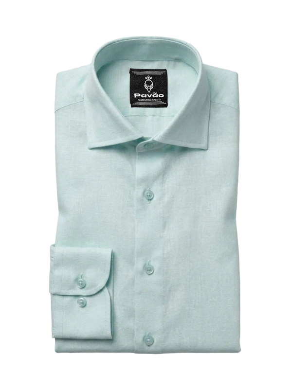 A folded light mint green dress shirt by Pavão, featuring a classic collar, button-down front, and a single-button cuff, displayed on a neutral light gray background.