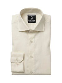 A folded cream-colored linen dress shirt by Pavão, featuring a classic collar, button-down front, and a single-button cuff, displayed on a light gray background.