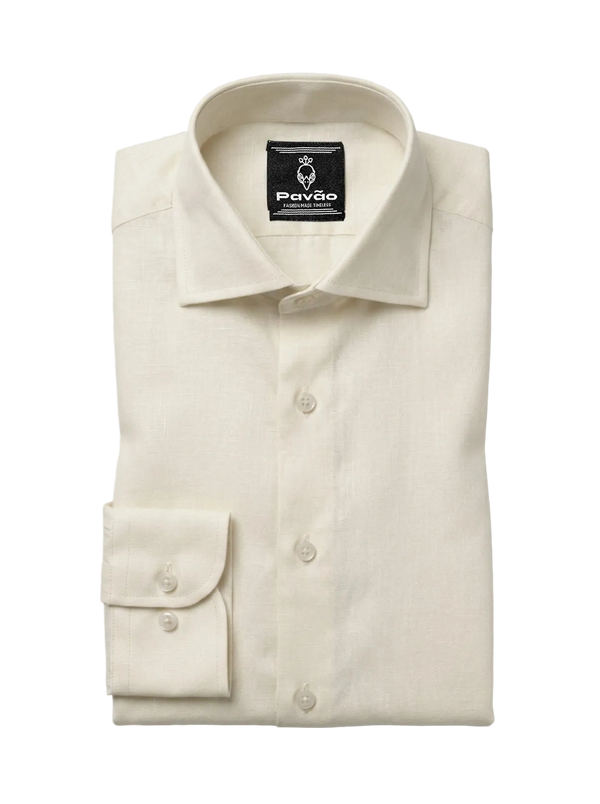 A folded cream-colored linen dress shirt by Pavão, featuring a classic collar, button-down front, and a single-button cuff, displayed on a light gray background.