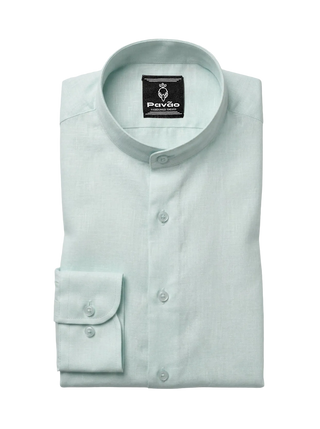 A folded light mint green dress shirt with a band collar and a single-button cuff, displayed on a neutral light gray background. The brand label 'Pavão' is visible inside the collar.