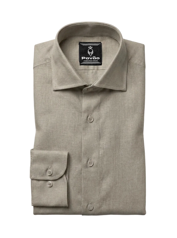 A folded light beige linen dress shirt with a button-down front and a single-button cuff, displayed on a clean white background. The brand label 'Pavão' is visible inside the collar.