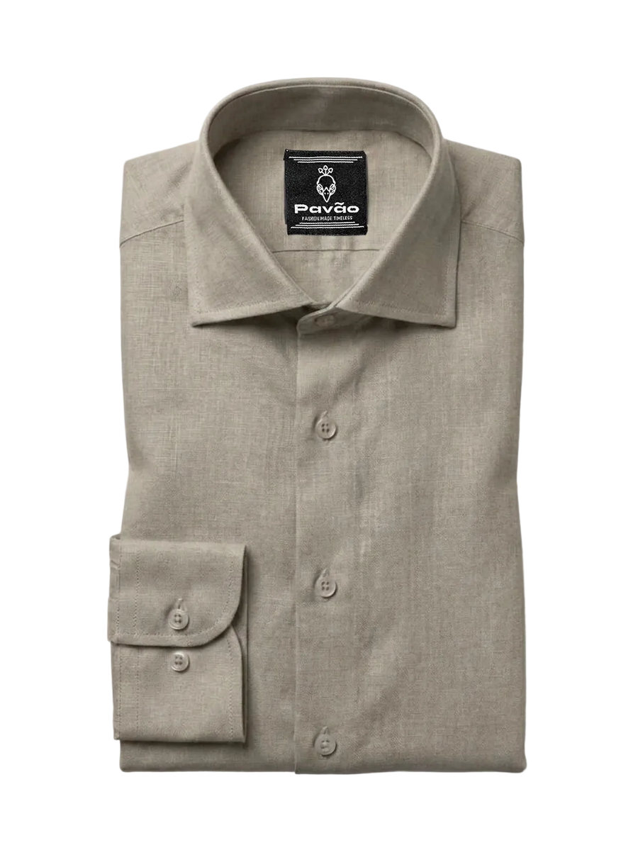 A folded light beige linen dress shirt with a button-down front and a single-button cuff, displayed on a clean white background. The brand label 'Pavão' is visible inside the collar.