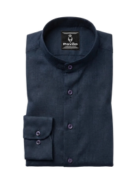 A folded dark navy blue long-sleeve dress shirt with a mandarin collar and purple buttons, shown on a light gray background. The brand label 'Pavão' is visible inside the collar.