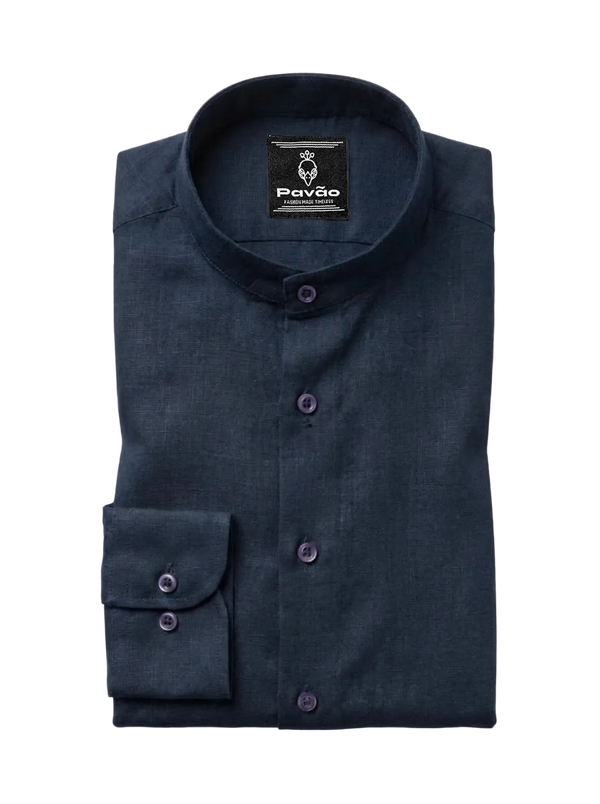 A folded dark navy blue long-sleeve dress shirt with a mandarin collar and purple buttons, shown on a light gray background. The brand label 'Pavão' is visible inside the collar.