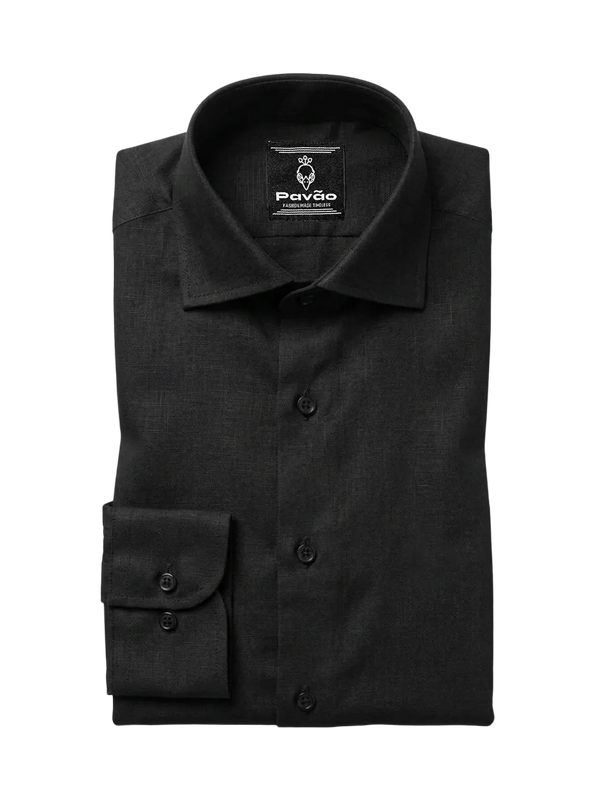 A folded black long-sleeve dress shirt with a pointed collar and button front, displayed on a light gray background. The brand label 'Pavão' is visible inside the collar.