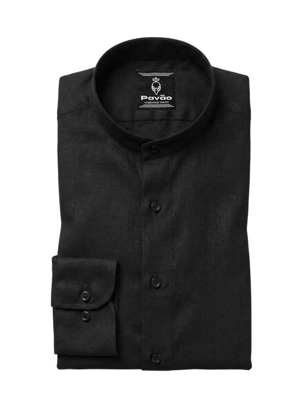 A folded black long-sleeve dress shirt with a mandarin collar and a single-button cuff, shown on a light gray background. The brand label 'Pavão' is visible inside the collar.