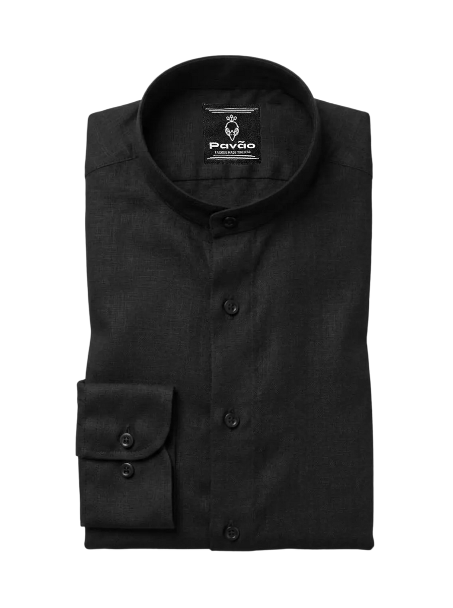 A folded black long-sleeve dress shirt with a mandarin collar and a single-button cuff, shown on a light gray background. The brand label 'Pavão' is visible inside the collar.