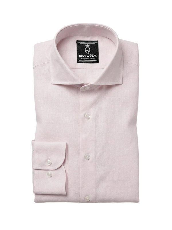 A folded light pink dress shirt with a spread collar and button front, displayed on a light gray background. The brand label inside the collar reads 'Pavão'.