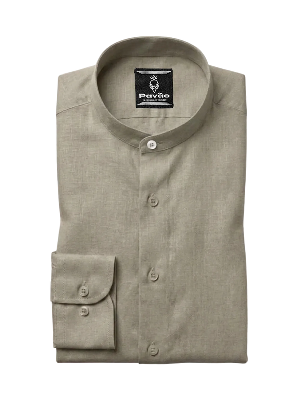 A folded light khaki linen shirt with a mandarin collar and a single buttoned cuff, displayed on a clean white background. The brand label 'Pavão' is visible inside the collar.