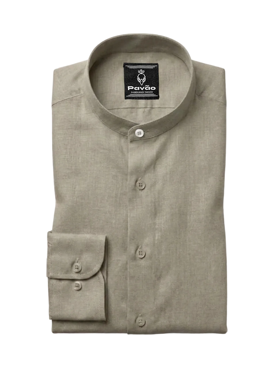 A folded light khaki linen shirt with a mandarin collar and a single buttoned cuff, displayed on a clean white background. The brand label 'Pavão' is visible inside the collar.