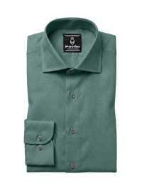 A folded sage green dress shirt with a spread collar and button-down front, featuring a brand label for 'Pavão' on the inside collar, set against a clean white background.