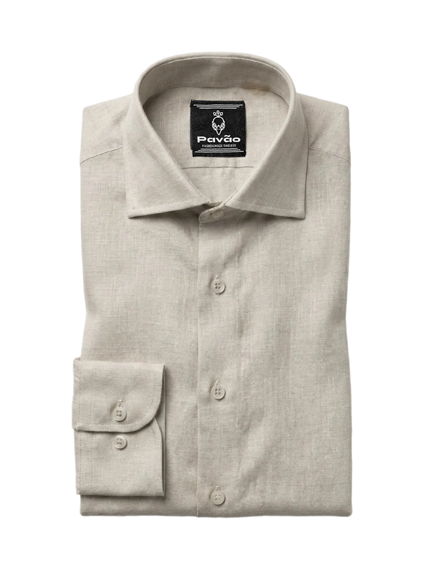 A folded light beige linen dress shirt with a button-down front and a single-button cuff, displayed on a clean white background. The brand label 'Pavão' is visible inside the collar.