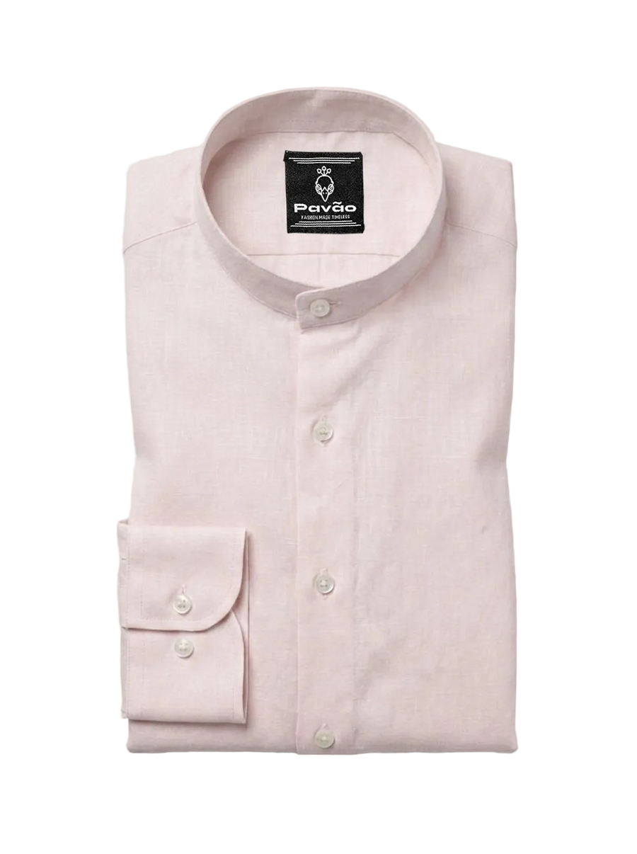 A folded light pink long-sleeve dress shirt with a band collar and a single-button cuff, displayed on a light gray background. The brand label 'Pavão' is visible inside the collar.