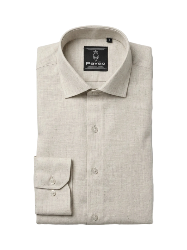 A folded light beige linen dress shirt with a button-down front, pointed collar, and a single-button cuff, shown on a plain white background. The brand label 'Pavão' is visible inside the collar.