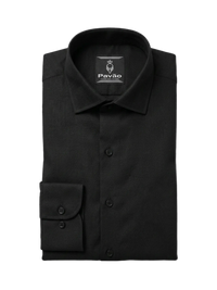 A folded black long-sleeved dress shirt with a pointed collar and a single buttoned cuff, displayed on a clean white background. The brand label 'PAVÃO' is visible inside the collar.