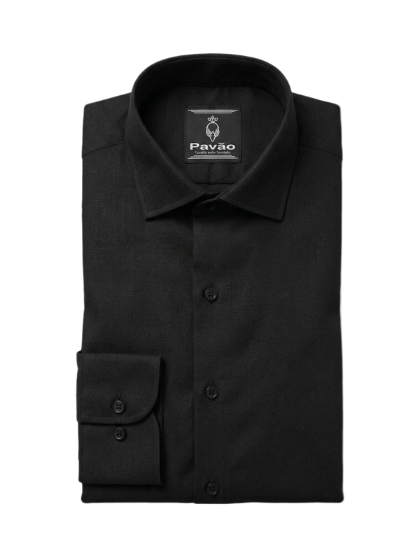 A folded black long-sleeved dress shirt with a pointed collar and a single buttoned cuff, displayed on a clean white background. The brand label 'PAVÃO' is visible inside the collar.