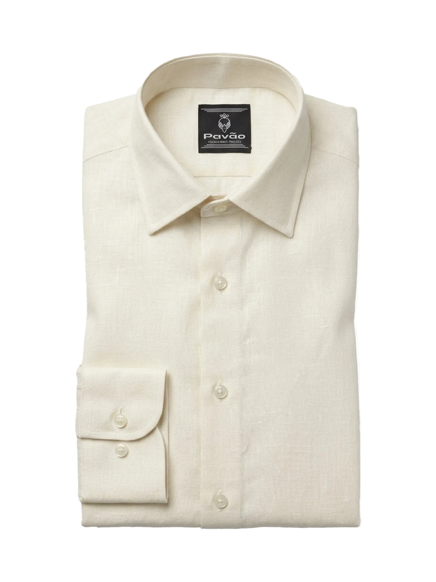 A folded cream-colored linen dress shirt with a spread collar and a buttoned cuff, displayed on a clean white background. The brand label inside the collar reads 'Pavão'.